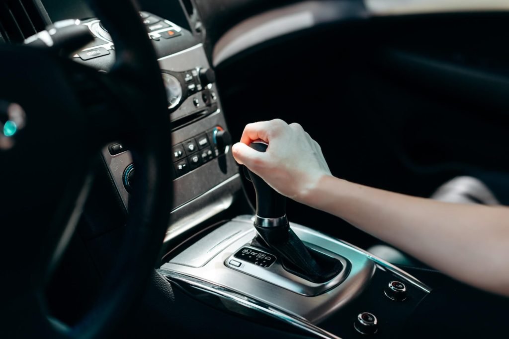 Driver shifting an automatic transmission during precision road testing
